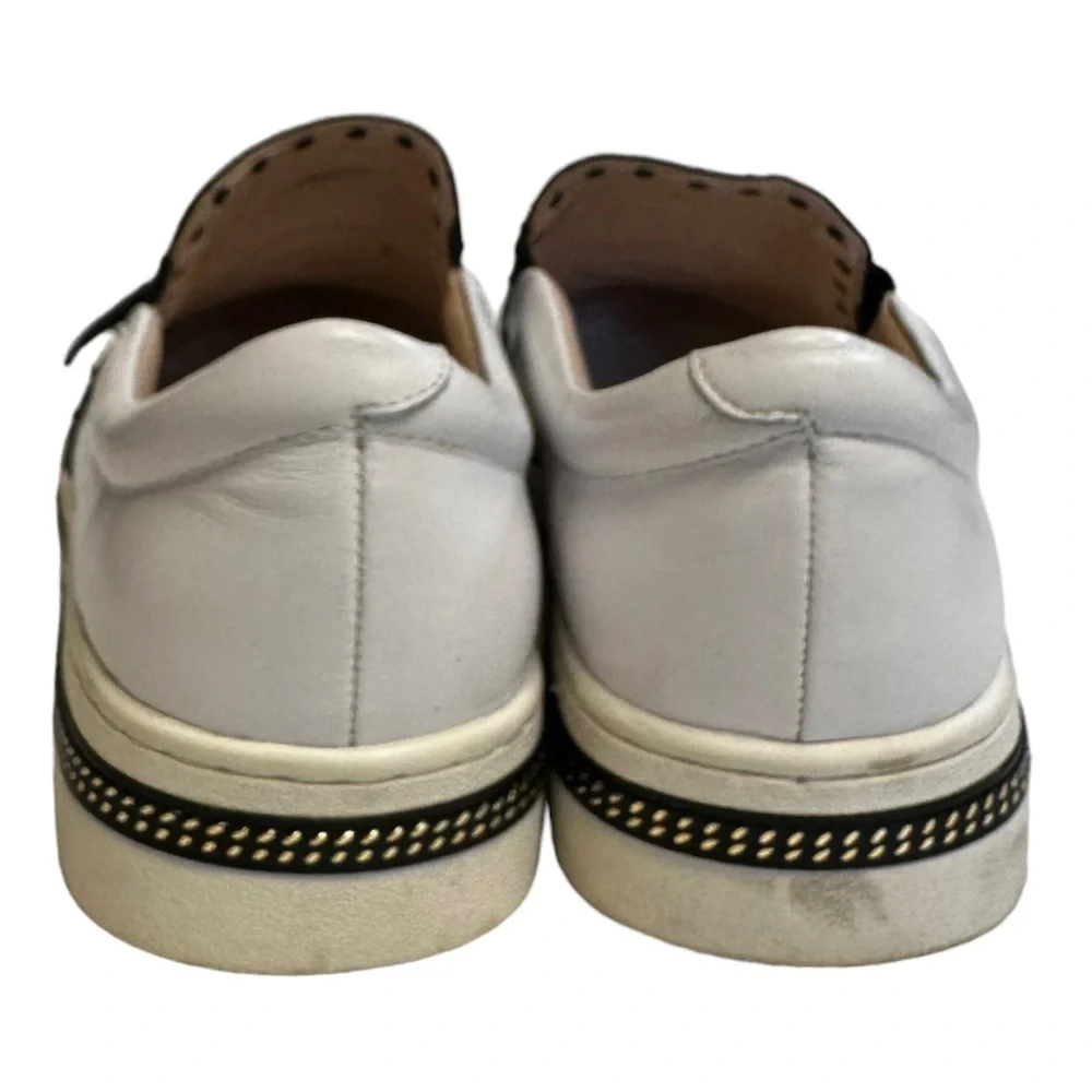 White Leather Slip-On Sneakers with Black Trim and Red Accent